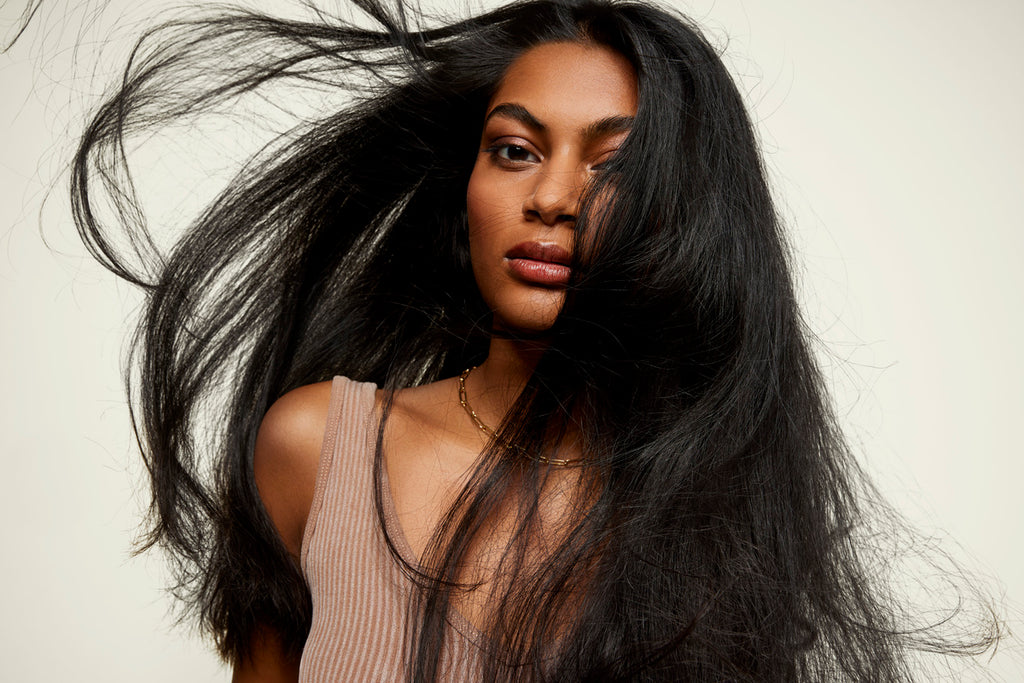 Woman with healthy, flowing, long black hair