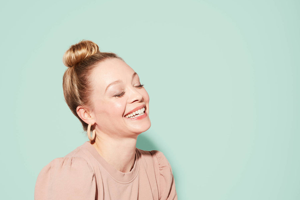 Woman wearing a topknot bun