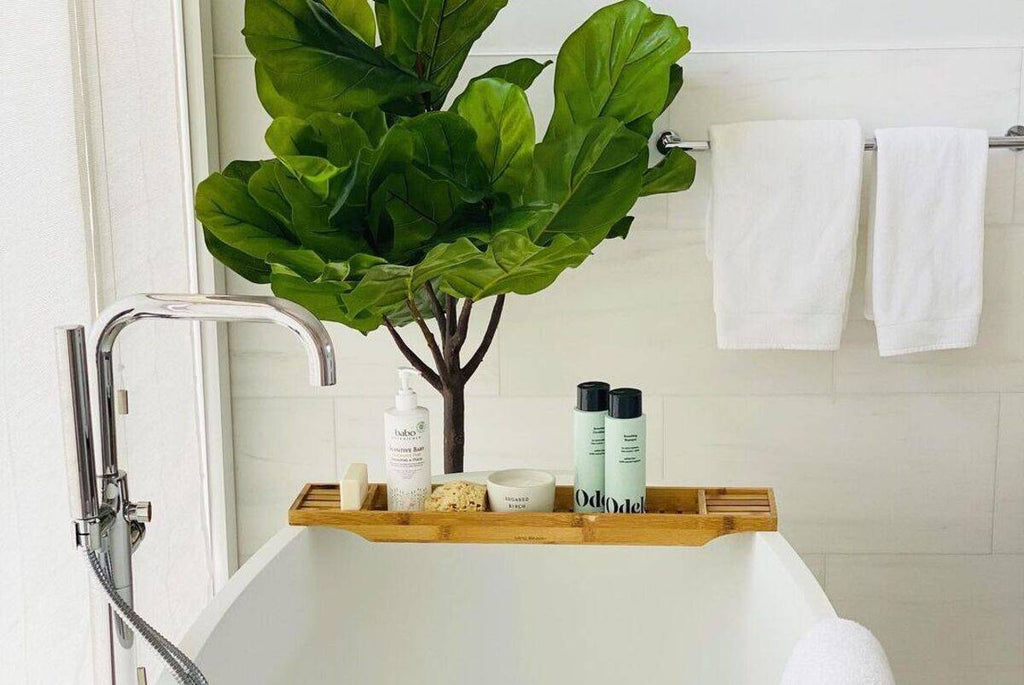 Odele Smoothing Shampoo and Conditioner in a bathtub