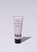 A tube of Odele Purple Conditioner stands upright against a plain, light-colored backdrop with the front of the label facing the camera.