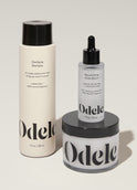 Odele Beauty’s Scalp Care Set is artfully arranged on a light surface.
