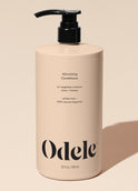 A beige bottle of Volumizing Conditioner Bulk with a black pump, minimalist text highlighting volume and weightless moisture benefits (32 fl oz / 946 ml), set against a neutral background.