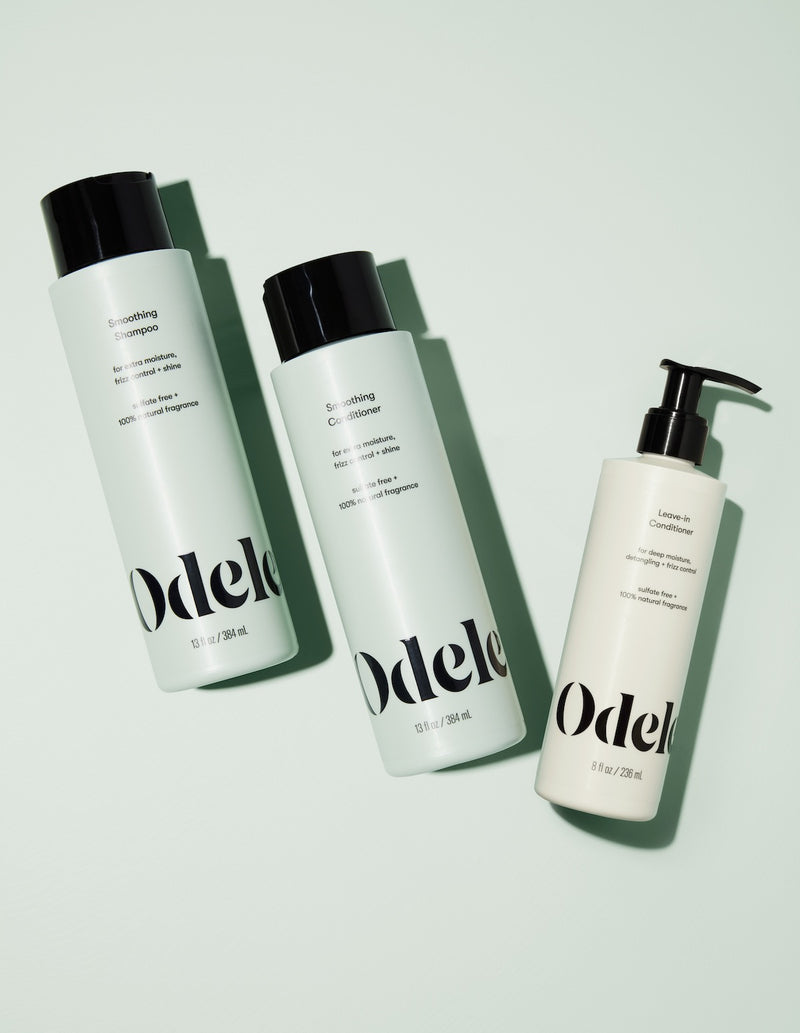 odele smoothing shampoo and conditioner alongside leave-in conditioner bottle