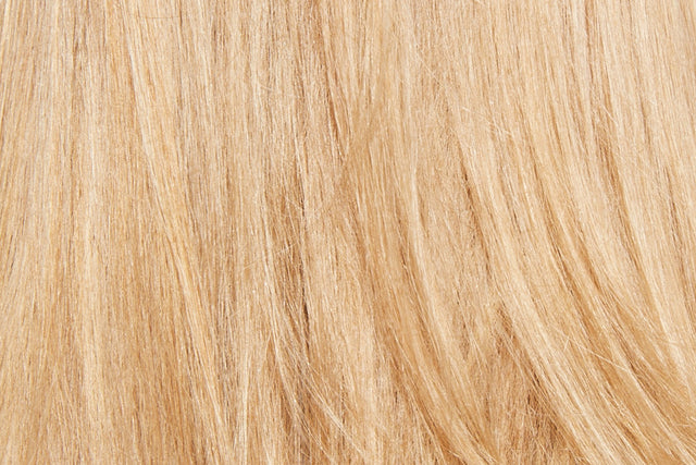 Texture closeup of straight, blonde hair