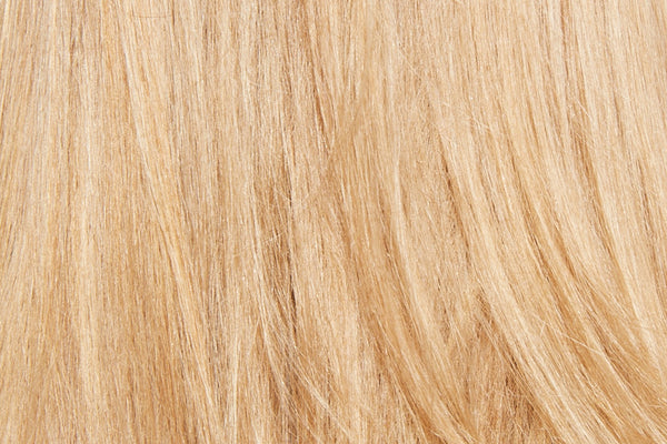 Texture closeup of straight, blonde hair