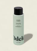 A light green bottle of Smoothing Conditioner with a black cap features text for extra moisture and frizz control. Sulfate-free with a natural fragrance, this conditioner enhances shine. The bottle is shown on a plain background.