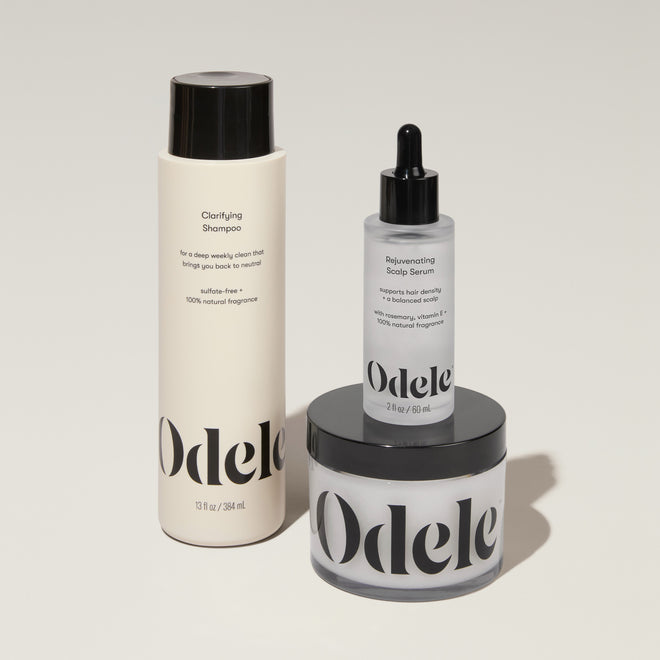 Odele Beauty’s Scalp Care Set is artfully arranged on a light surface.