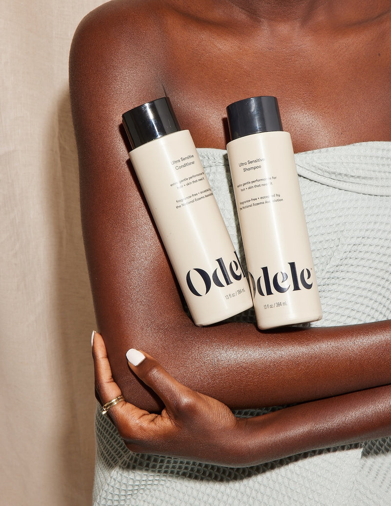person cradling odele products in arm
